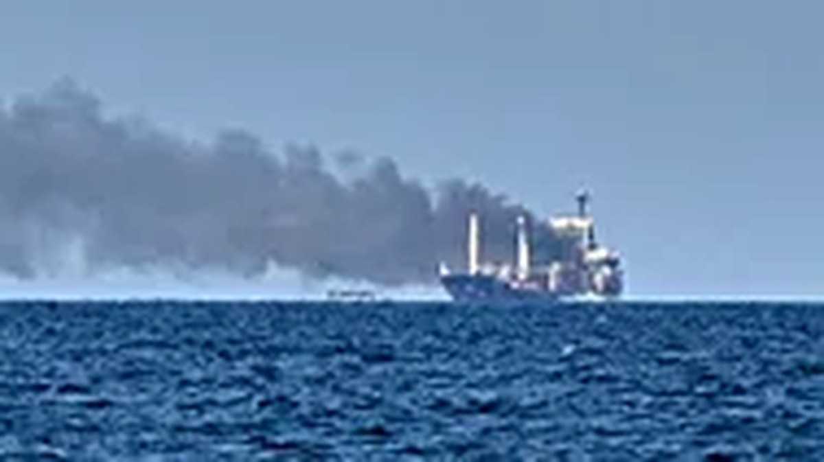 Smoke rises from the grain carrier Golden Leo under the Guinea-Bissau flag after Russian missile strike in the Black Sea close to Odesa