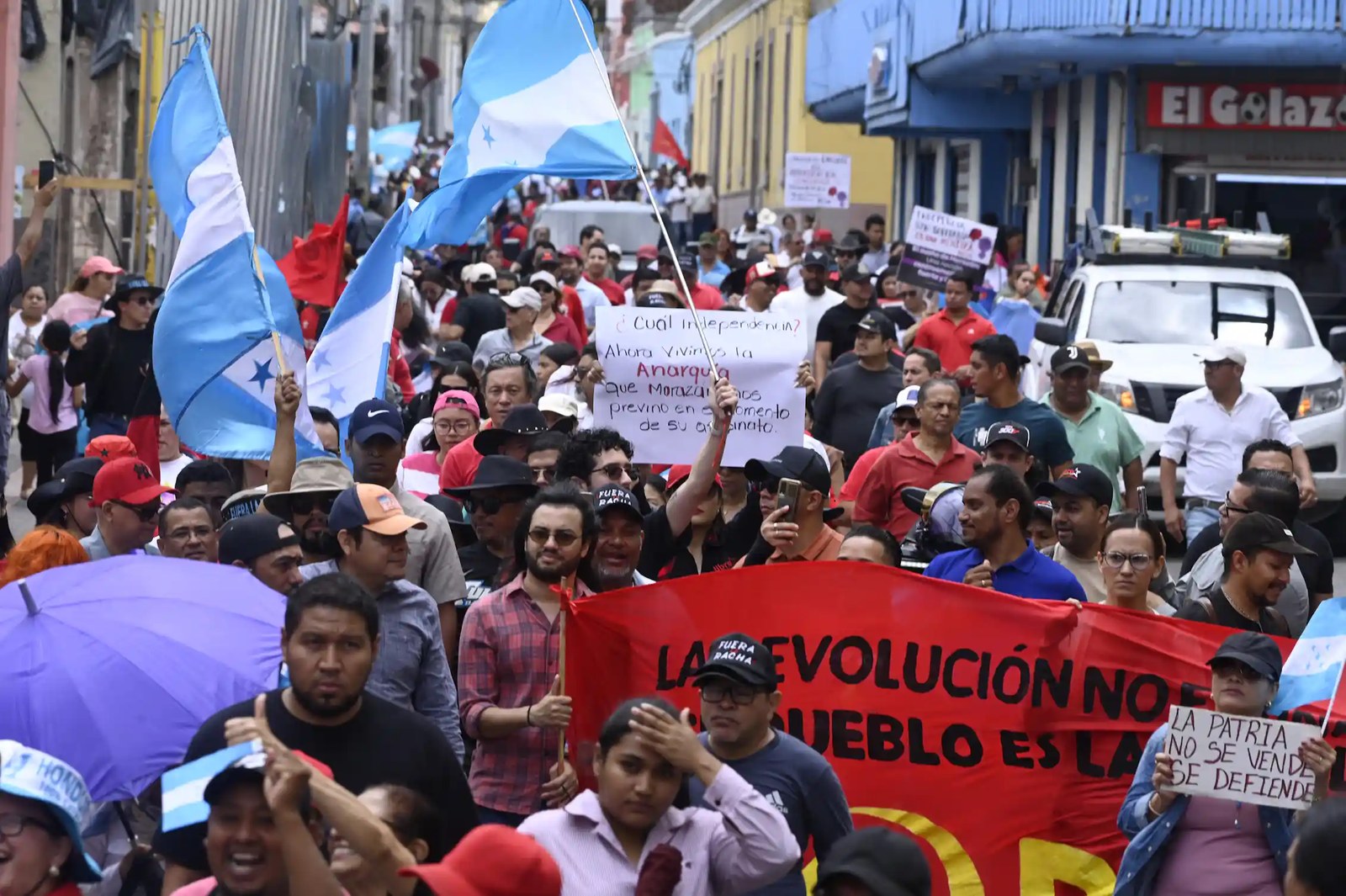 Demonstrators rally in a public square.