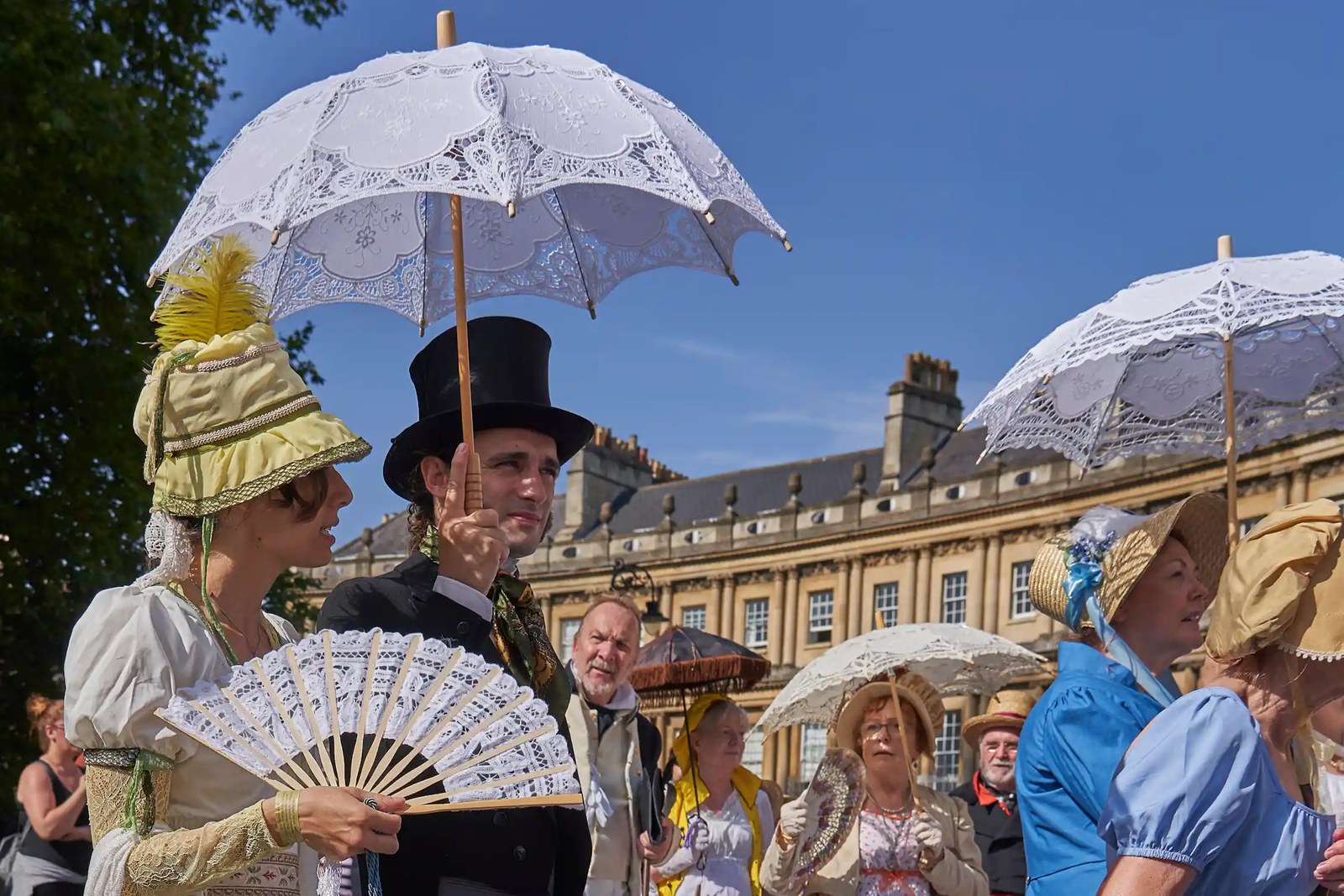 Parade of people dressed in period costume from the Georgian era as part of the annual Jane Austen festival in Bath