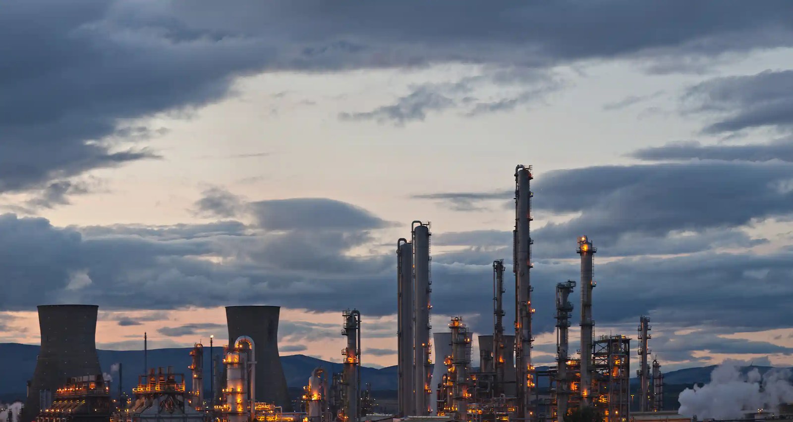 oil refinery, silhouette, cloudy sky
