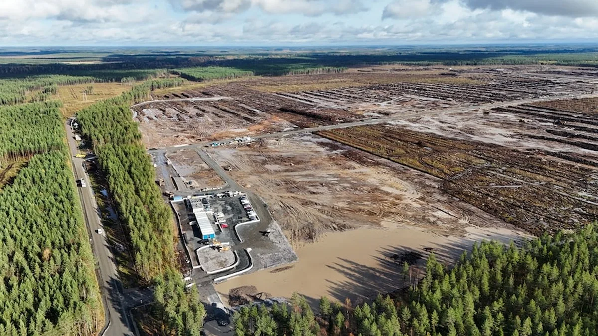 An aerial image shows a large, clear-cut block of land with muddy water throughout.
