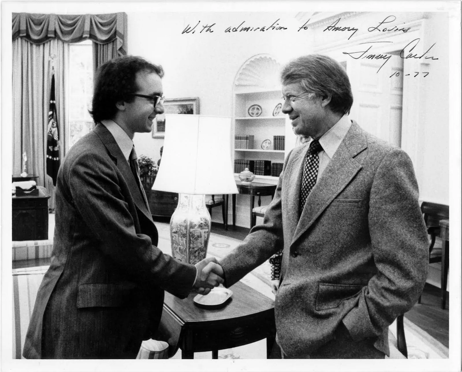 Amory Lovins, left, shakes hands with then-President Jimmy Carter in the Oval Office in 1977. Rocky Mountain Institute