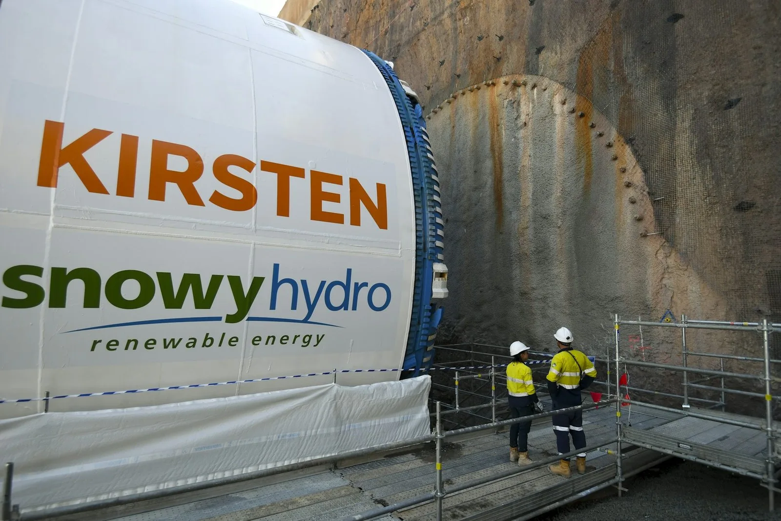 Workers look at a Tunnel Boring Machine, part of the Snowy Hydro Scheme, in December 2021. Lukas Coch/AAP