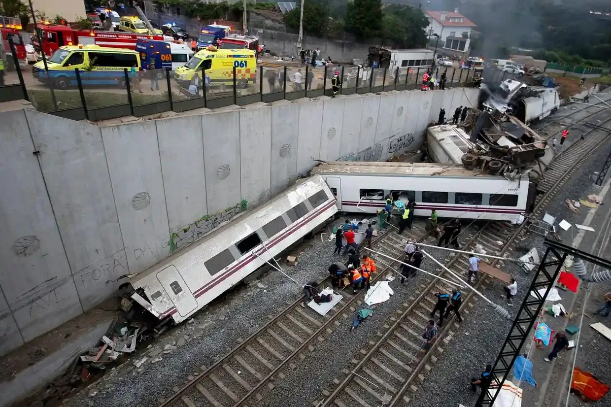 Rescue workers help passengers from two derailed carriages 