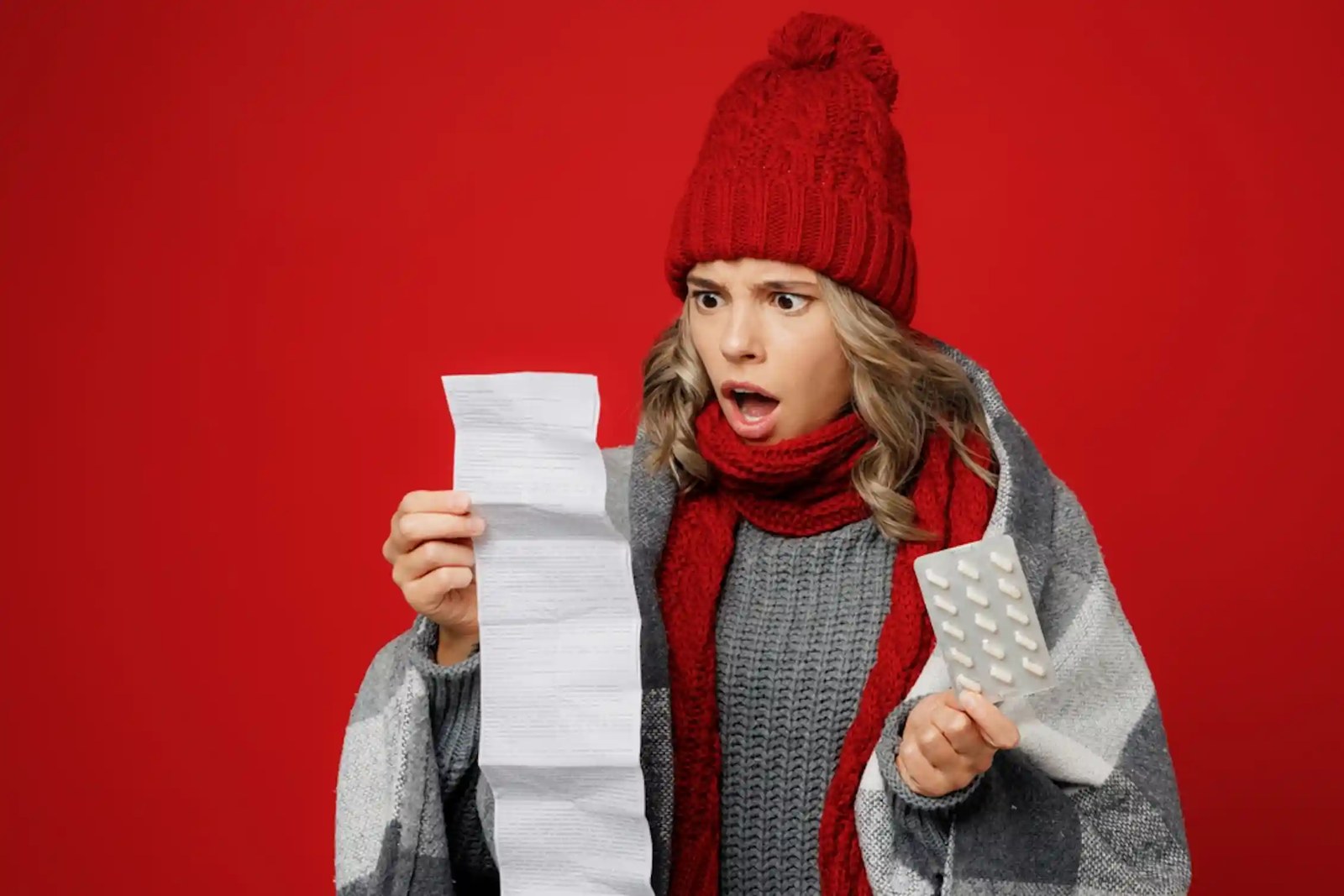 A woman reading a very long list of drug side-effects.