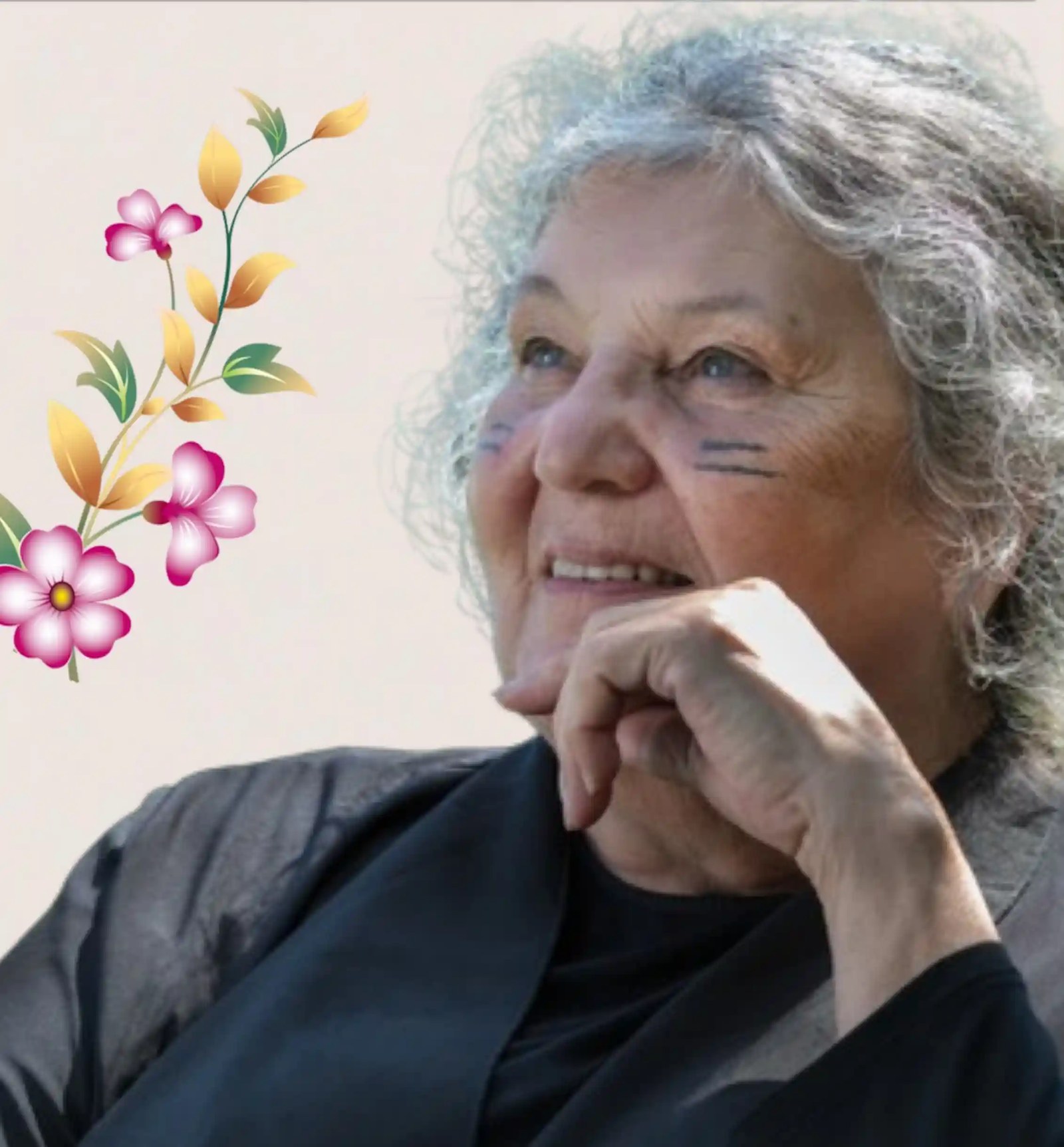 Image of a woman surrounded by floral desigh.