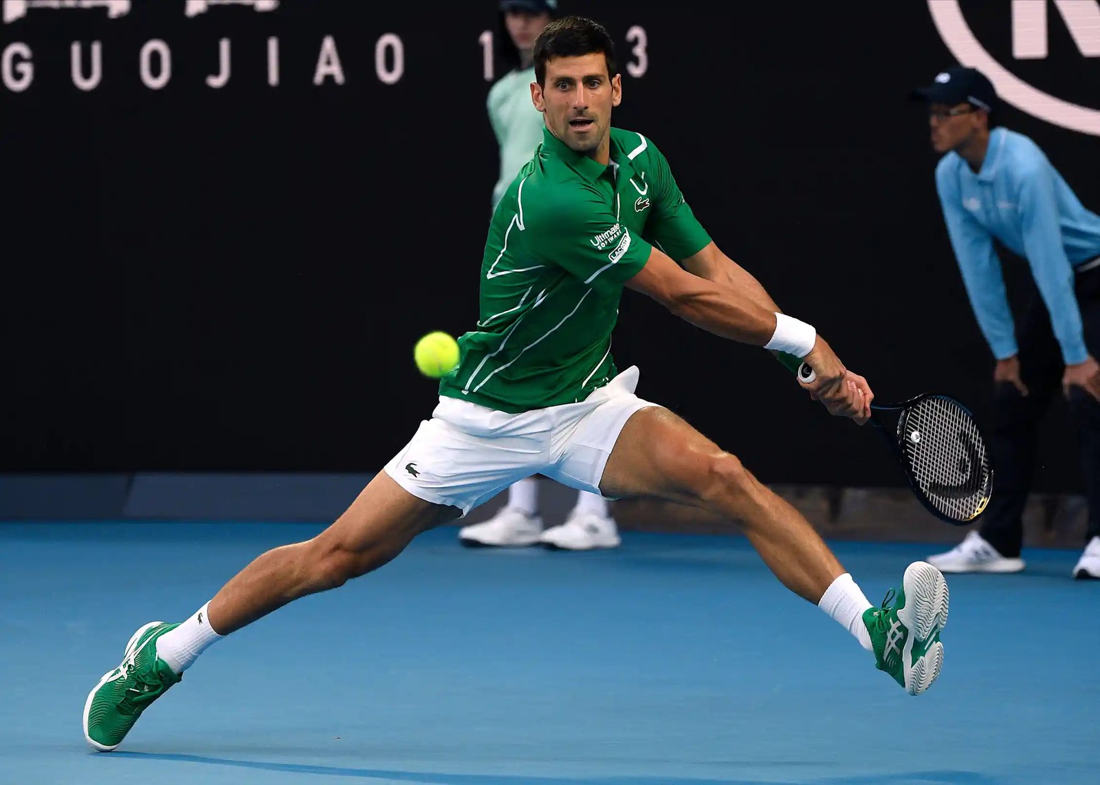 Novak Djokovic making a backhand return.