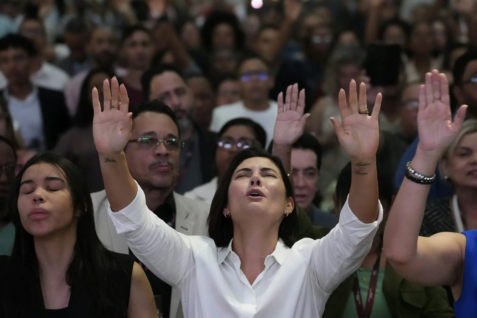Brazil’s former first lady Michelle Bolsonaro prays for her husband, Jair Bolsonaro, at an evangelical church on the outskirts of Brasilia, Brazil, on July 24, 2025. AP Photo/Eraldo Peres