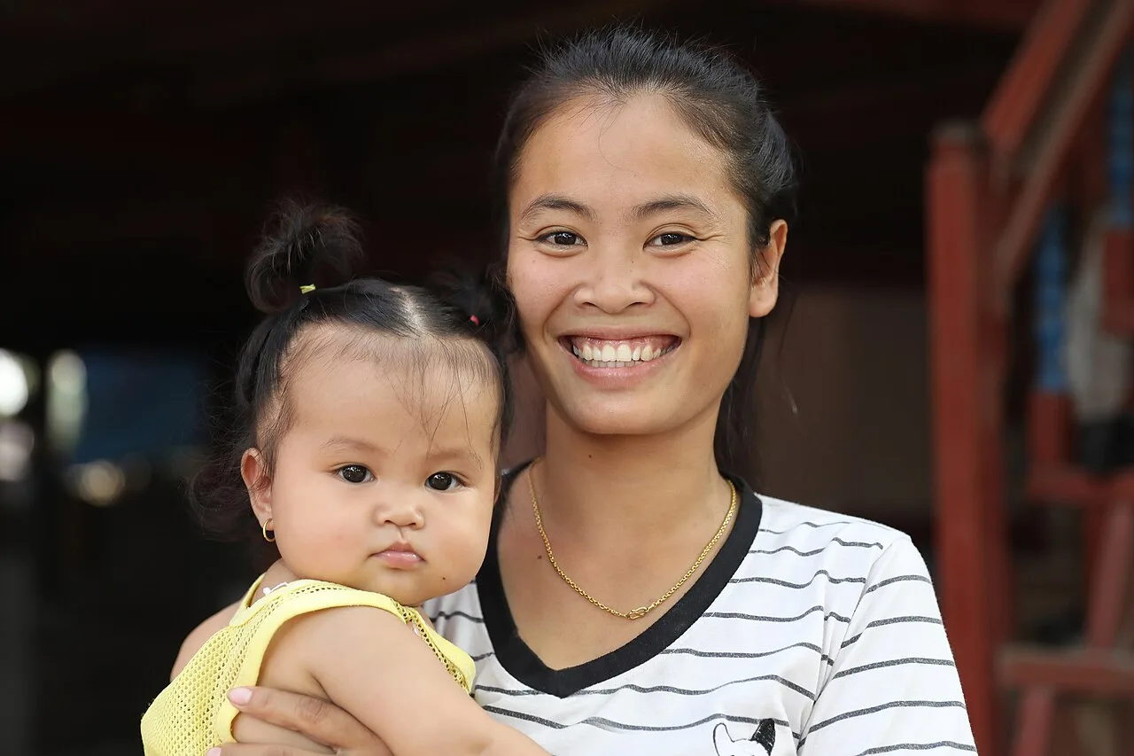 An infant with her mother, a possible attachment figure
